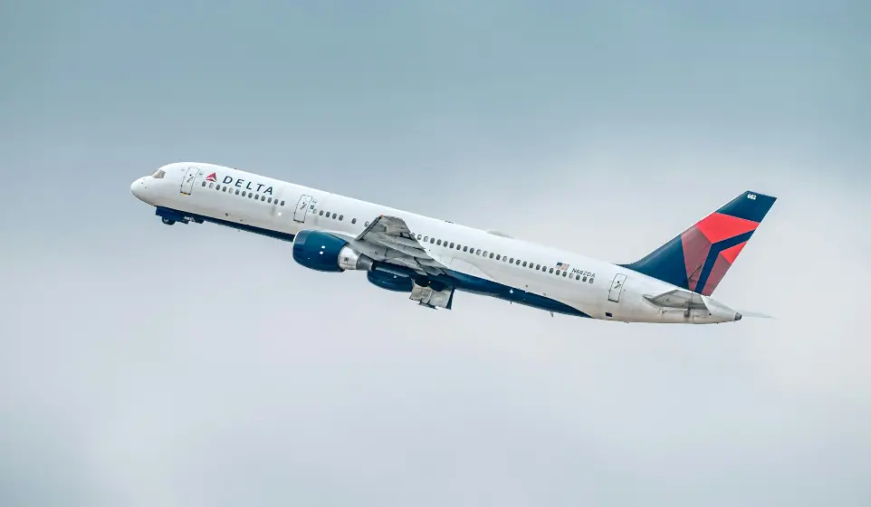 a large passenger jet flying through a cloudy sky